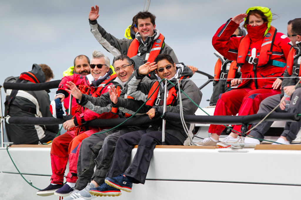 Smiling faces on a corporate yacht charter